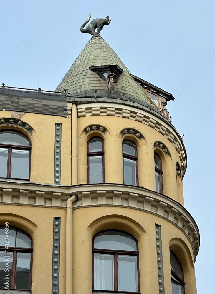 Cat statue on a roof of the Cat House or Kaķu nams in the old town of Riga, Latvia, June 2024