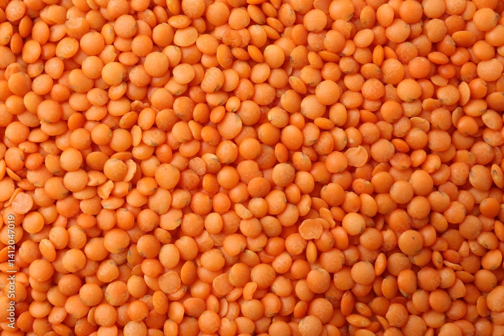 Raw red lentils as background, closeup view Raw red lentils as background, closeup view