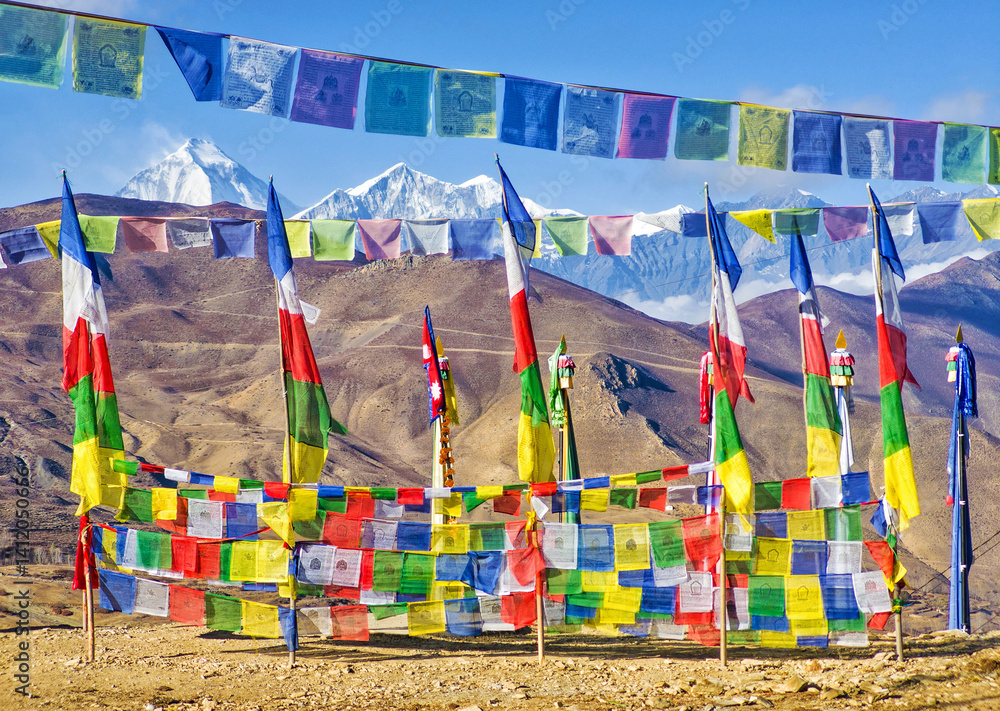 Himalayas, Nepal - The famous hiking on the roof of the world called Annapurna Circuit in the Himalaya range mountain, with little village, buddhist stupa and mountains of 8000 meters.