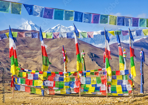 Obraz na płótnie Himalayas, Nepal - The famous hiking on the roof of the world called Annapurna Circuit in the Himalaya range mountain, with little village, buddhist stupa and mountains of 8000 meters. w salonie