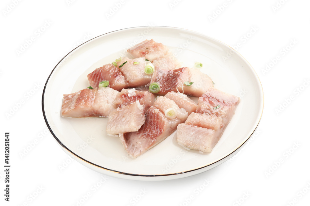Pieces of delicious herring with green onions isolated on white Pieces of delicious herring with green onions isolated on white