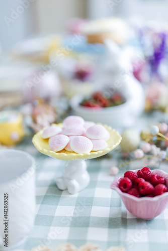 Easter table with pink candy on yellow platter