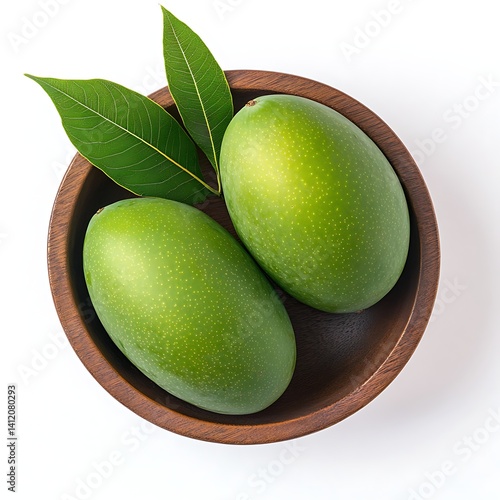 Wallpaper Mural Green mangoes in a wooden bowl, isolated on a white background Torontodigital.ca