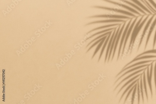Shadows of a Palm Leaf Cast on a Textured Beige Wall Creating a Calming Atmos...