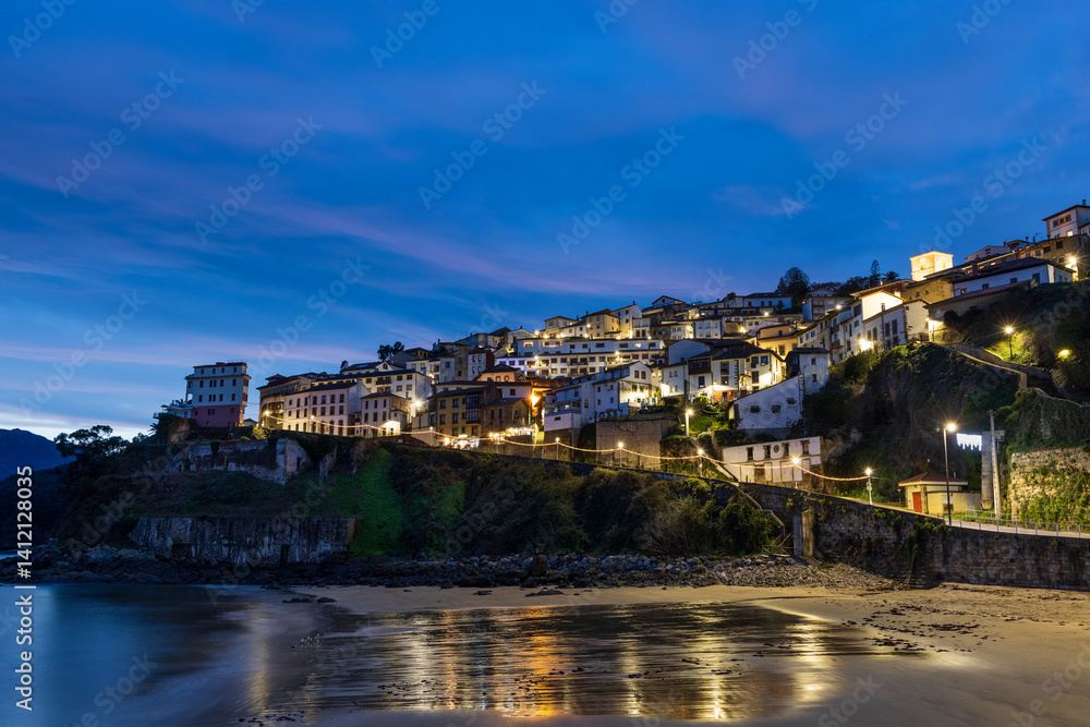 Fototapeta premium Night view of Lastres from the beach. Asturias, northern Spain.