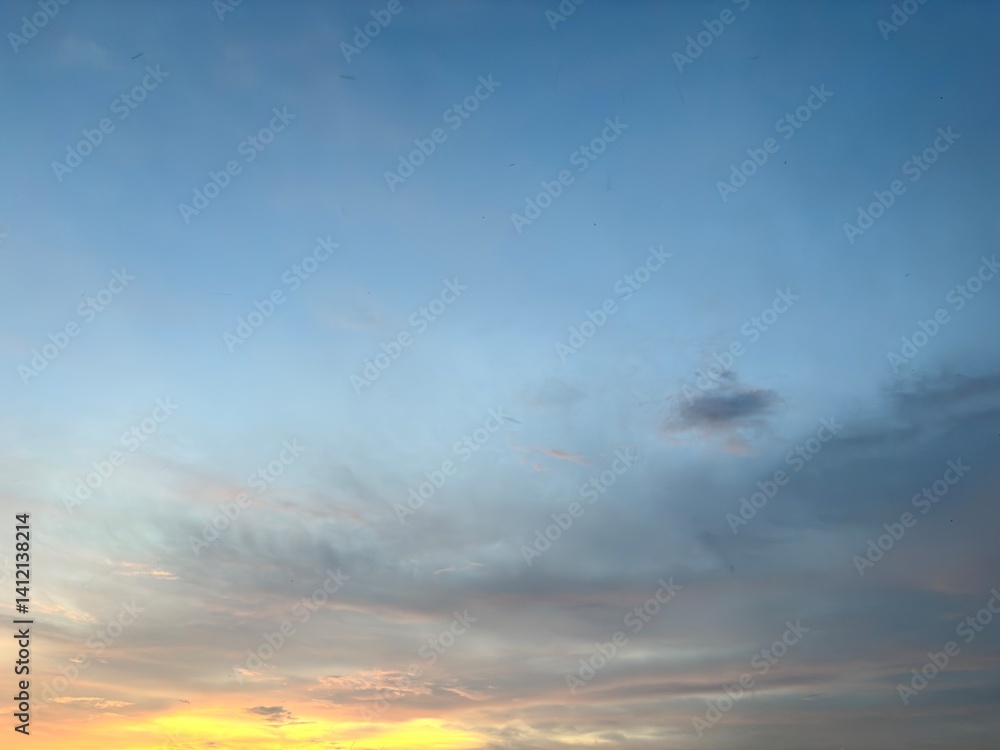 Obraz premium Beautiful sky with natural gradations. Thick clouds in the dusk sky on a winter night. Image of a cloudy sky in the afternoon. View of the night sky with golden light from the evening sun