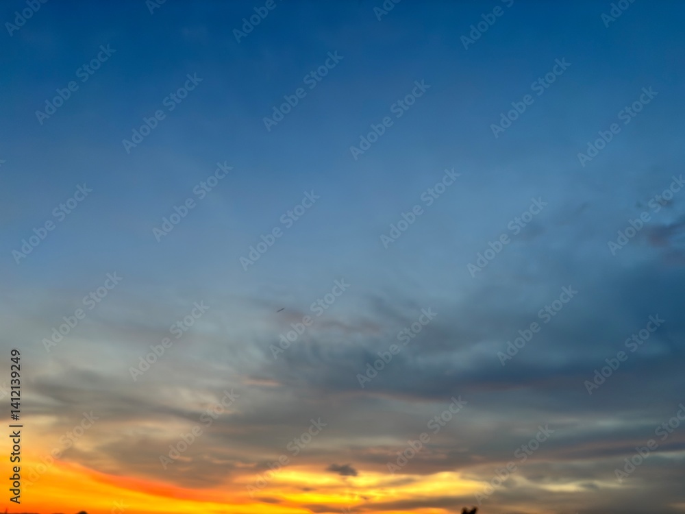 Beautiful sky with natural gradations. Thick clouds in the dusk sky on a winter night. Image of a cloudy sky in the afternoon. View of the night sky with golden light from the evening sun Beautiful sky with natural gradations. Thick clouds in the dusk sky on a winter night. Image of a cloudy sky in the afternoon. View of the night sky with golden light from the evening sun