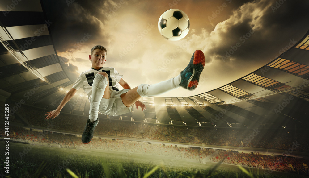 Boy in white soccer uniform flies in kick motion aiming at goal under glowing lights. 3D render of stadium. Concept of sport, ambition, competition, teamwork, youth athletics, tournament