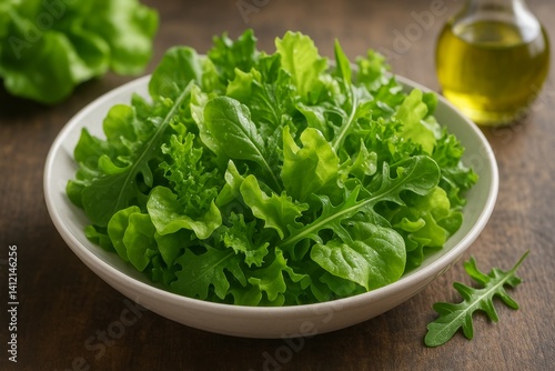 Fresh Mixed Greens Salad With Olive Oil on a Rustic Wooden Table