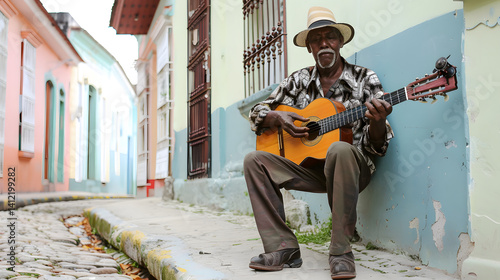 Traditional Cuban musician playing guitar on the street in Trinidad, showcasing culture and artistry
