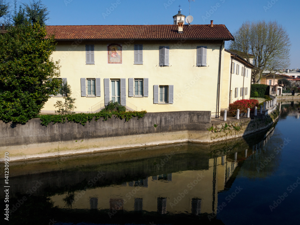 Old buildings along the canal Martesana at Gorgonzola, Italy