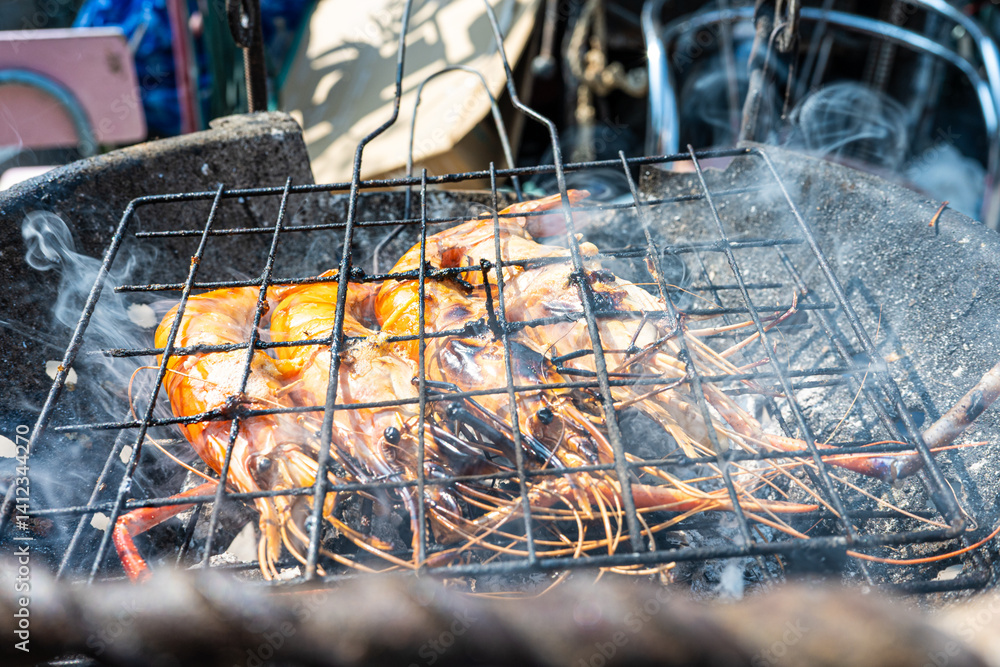 Big river prawn shrimp grilled on fire with smoke