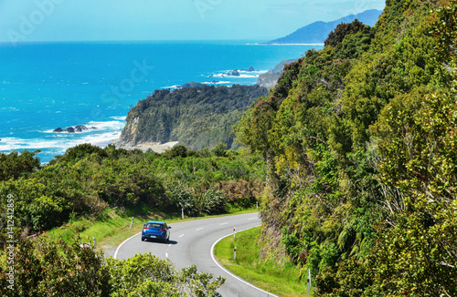 New Zealand Haast Highway: A scenic road winds along the western shore of New Zealand's South Island.