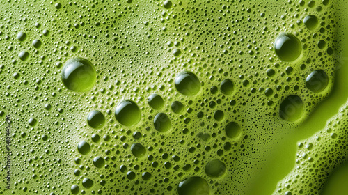 green matcha tea with frothy microfoam, a macro and full-frame texture shot, close-up texture, top view