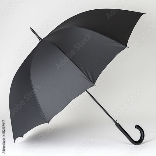 Obraz na płótnie a dark grey umbrella the handle and pole is aluminum, white background w salonie