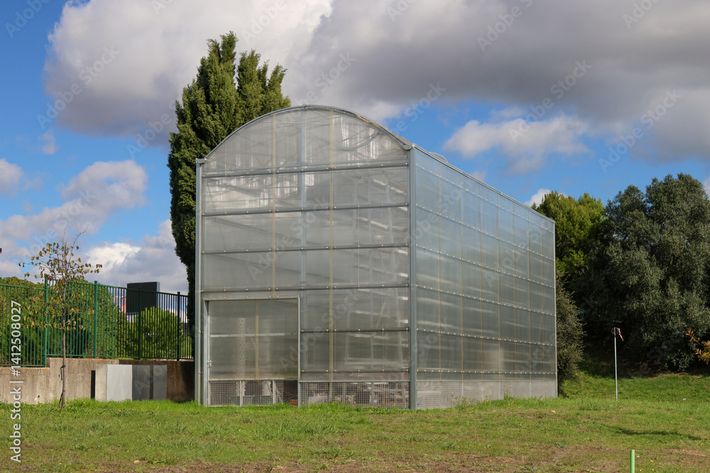 Greenhouse standing in aquilino ribeiro machado garden and horticultural park in lisbon Greenhouse standing in aquilino ribeiro machado garden and horticultural park in lisbon