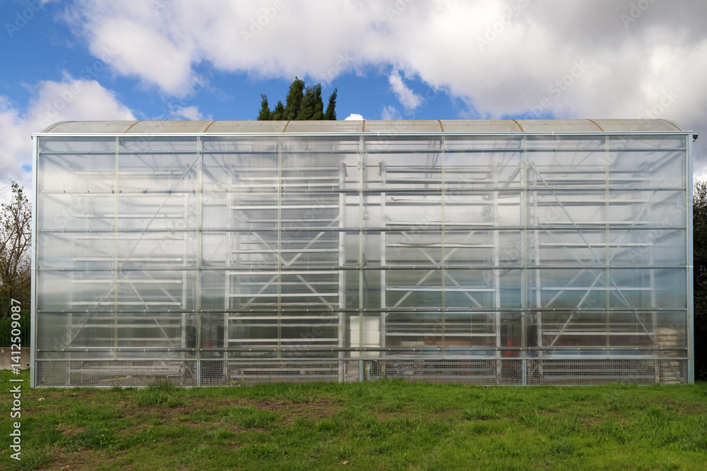 Large greenhouse structure standing in aquilino ribeiro machado garden and horticultural park Large greenhouse structure standing in aquilino ribeiro machado garden and horticultural park