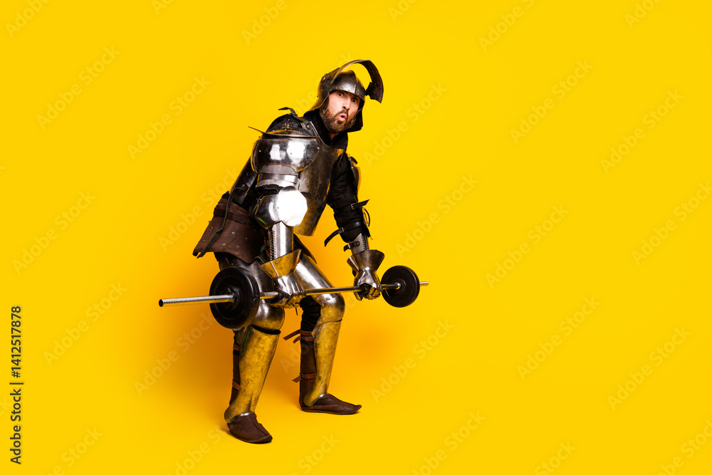 Naklejka premium Male knight lifting weights in medieval armor on a yellow background
