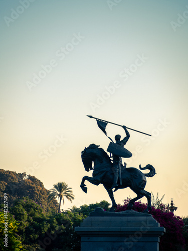 Silhouette of a statue of a victorious knight on a horse