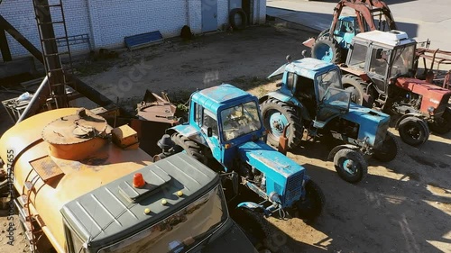 4K. Close-up of a modern tractor parked outdoors.