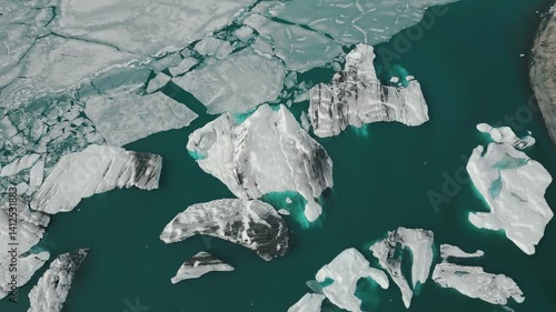 (4K) Iceland Aerial Top Down Drone View - Slow Orbit Above Jökulsárlón Glacier Lagoon Ice Formations - Frozen Scenery in Vatnajökull National Park, Vatnajökulsþjóðgarður