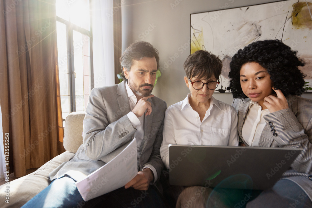Fototapeta premium Business team analyzing data on laptop, evaluating project results in office
