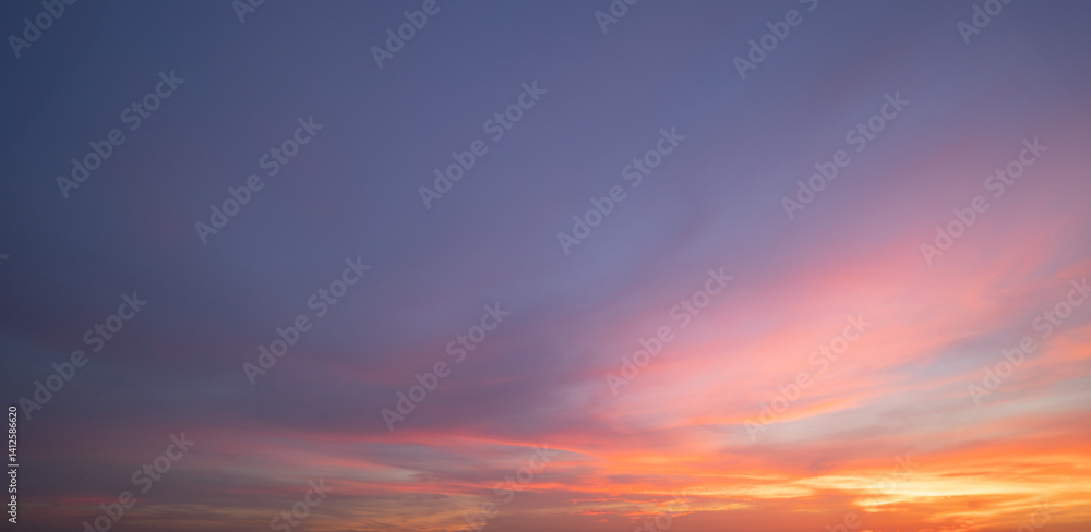 Obraz premium Sunset sky. Abstract nature background. Dramatic blue with orange colorful clouds in twilight time.