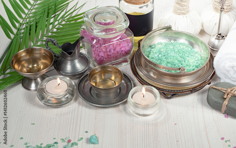 Spa massage items are arranged in a composition on the table.