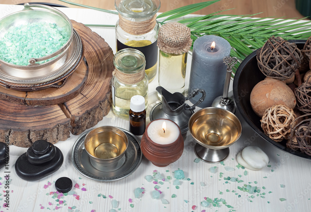 Spa treatment with candles and towel on wooden table, close up