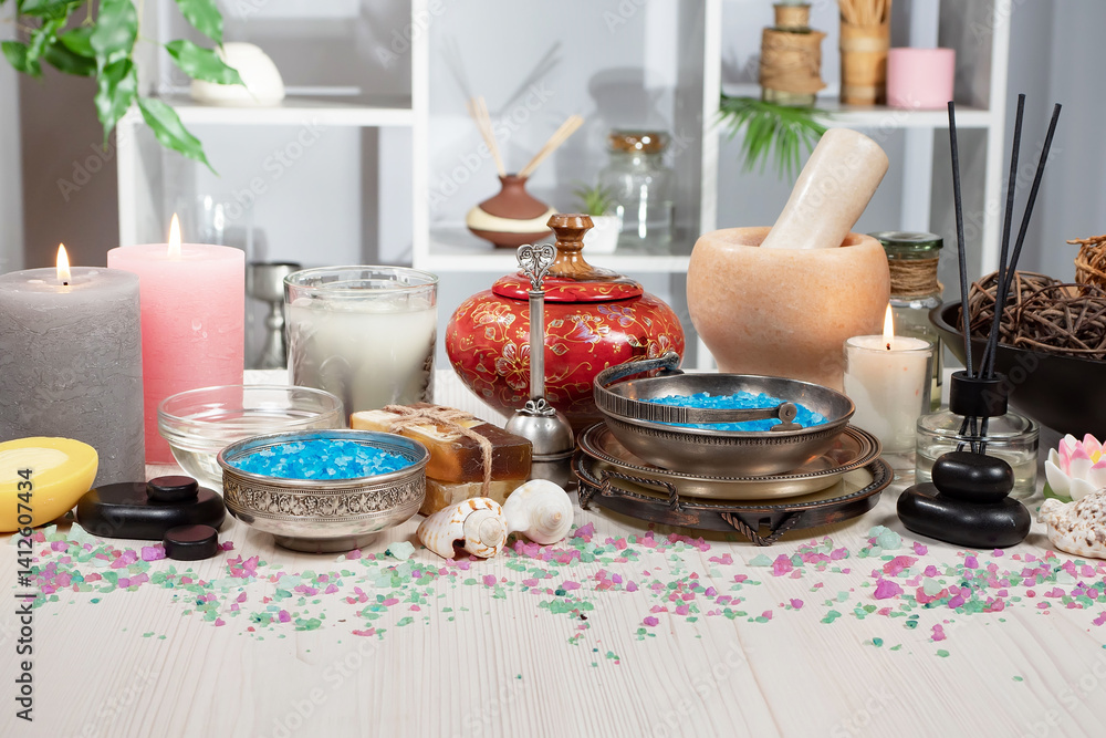 Spa treatment with candles and towel on wooden table, closeup