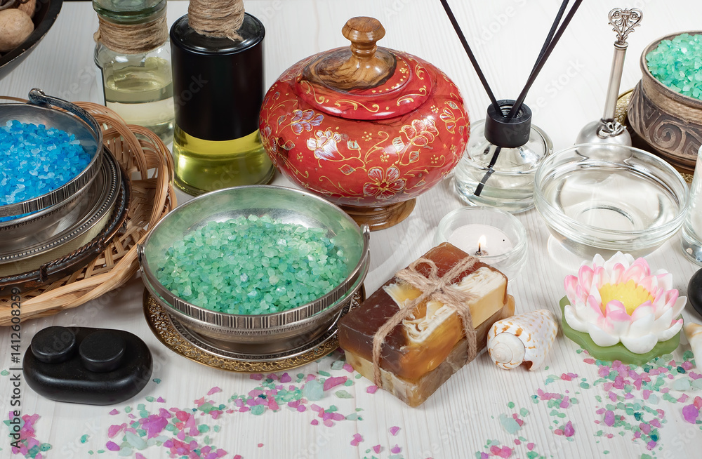 Spa treatment with candles and towel on wooden table, closeup