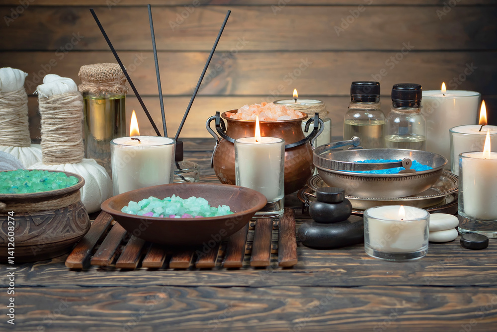 Spa treatment with candles and towel on wooden table, closeup