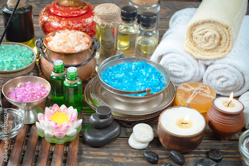 Spa massage items are arranged in a composition on the table.