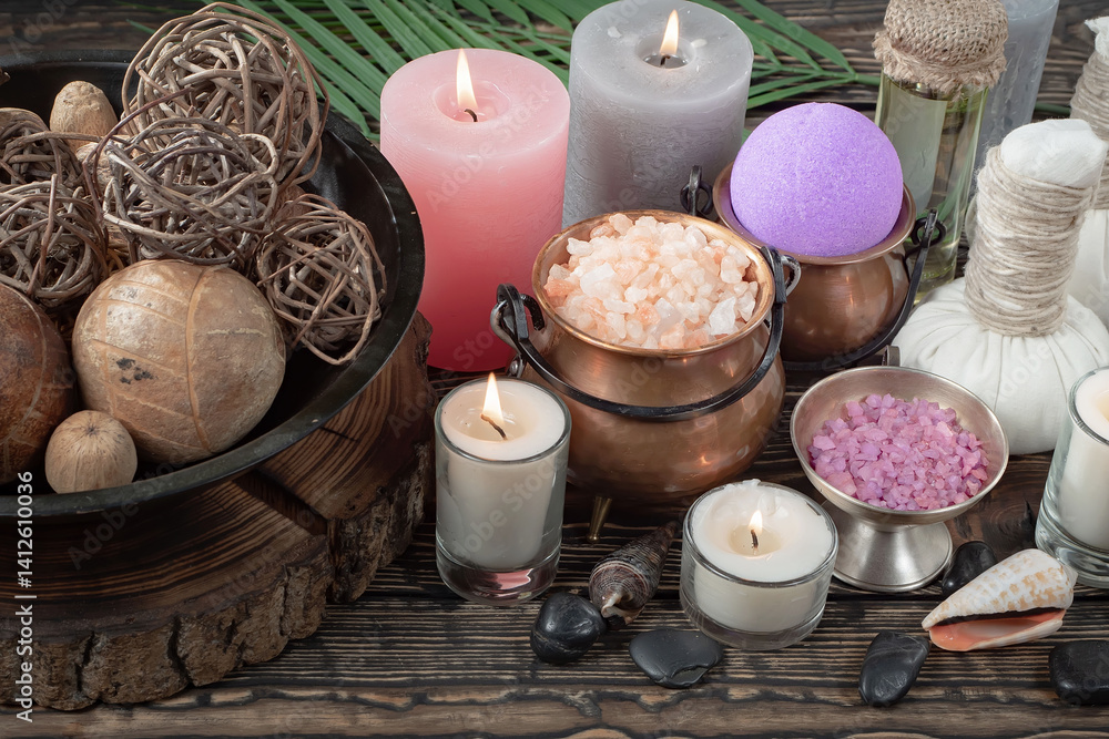 Spa treatment with candles and towel on wooden table, closeup
