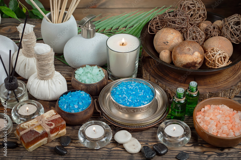 Spa massage items are arranged in a composition on the table.
