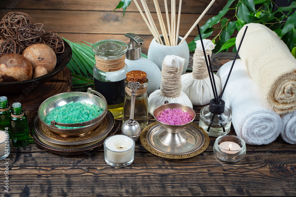 Spa massage items are arranged in a composition on the table.