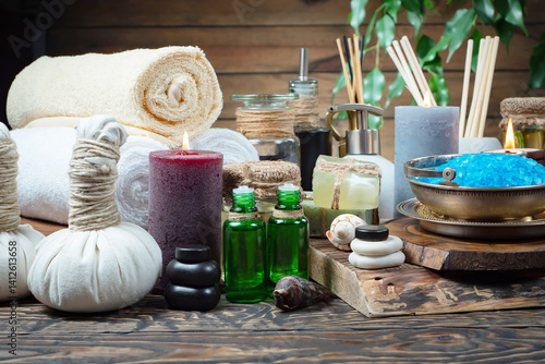 Spa massage items are arranged in a composition on the table.