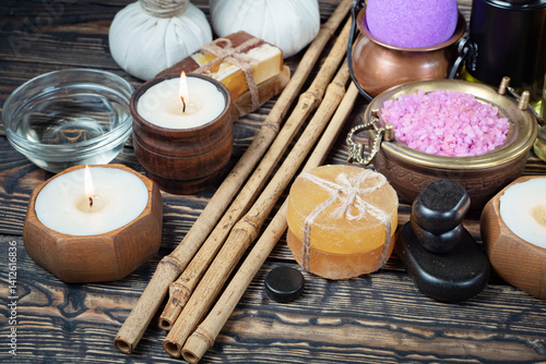 Spa massage items are arranged in a composition on the table.