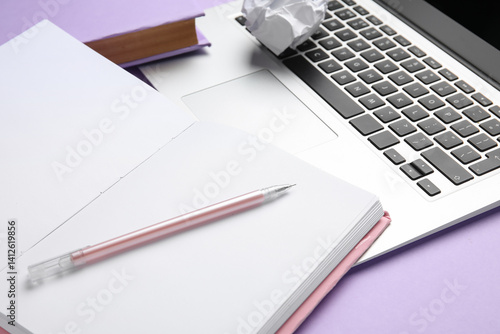 Blank open book, pen and la...