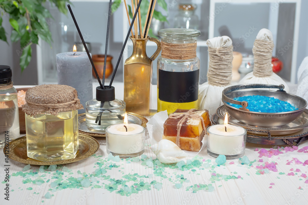 Spa treatment with candles and towel on wooden table, closeup
