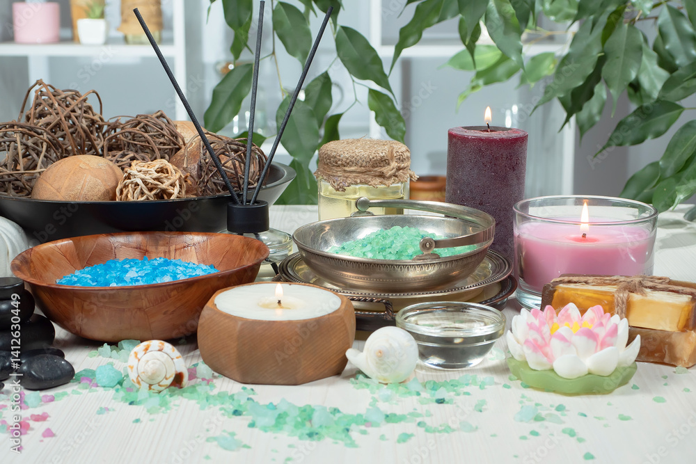 Spa treatment with candles and towel on wooden table, closeup