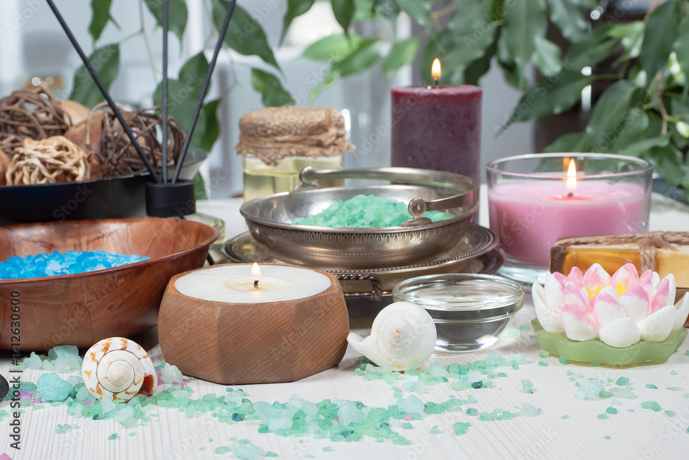 Spa treatment with candles and towel on wooden table, closeup