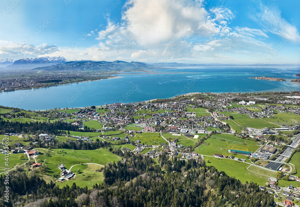 Fototapeta premium aerial view of the city of Lochau at Lake Constance with the highway entrance to Pfaender Tunnel in Vorarlberg, Austria