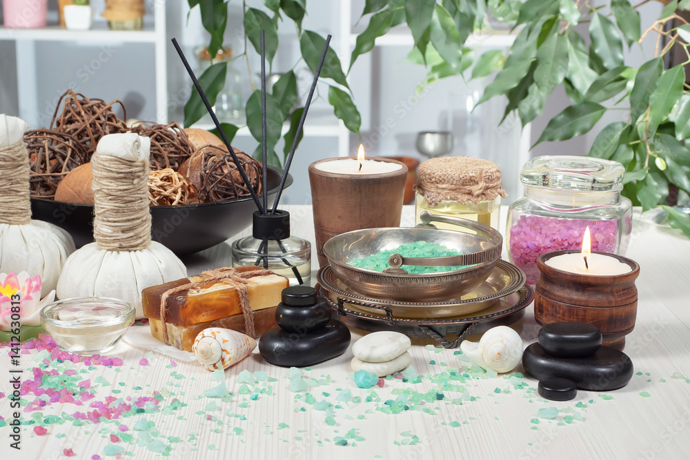 Spa treatment with candles and towel on wooden table, closeup