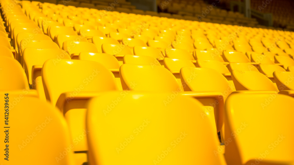 Fototapeta premium Rows of Empty Yellow Stadium Seats Highlighting Minimalist Design and Vibrant Colors in an Open-Air Venue