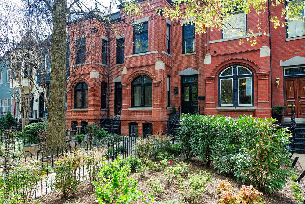Naklejka premium Colonial Brick Row House, Townhouse with Entrance Porch and Garden on Quiet Street in Washington, D.C., USA