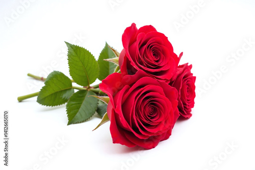 bunch of red roses sitting on top of a white table