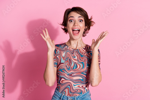 Photo of crazy cheerful nice glad girl wear stylish clothes celebrate success isolated on pink color background