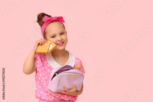 Cute little girl with cosme...