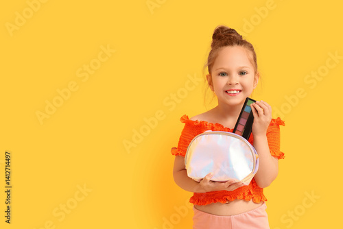 Cute little girl with cosme...